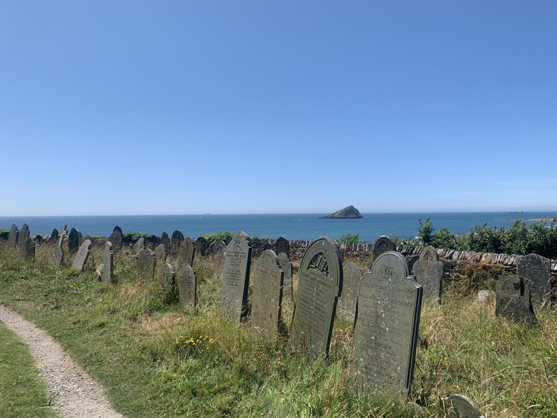 Church yard grave stones and Great Mew stone - Photo credit Kate Duncan 